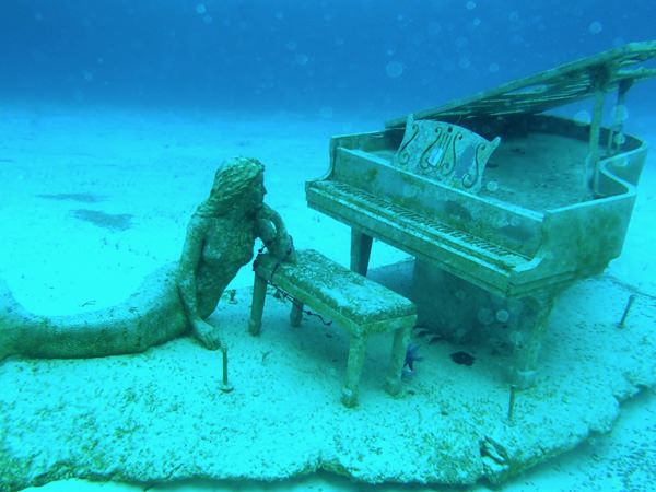 Mermaid and the Piano, placed in the water by David Copperfield, near his private island