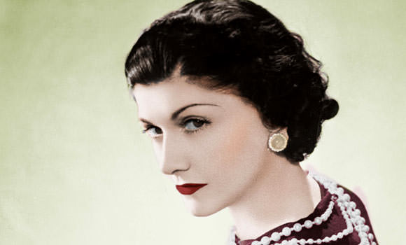 Coco Chanel with red lipstic