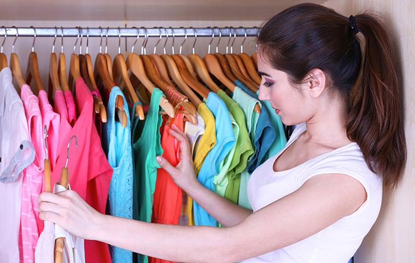 Young woman choose clothes in wardrobe at home; Shutterstock ID 189597512; PO: TODAY.com